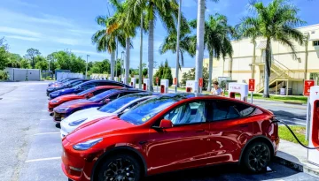 Photo of a row of charging Teslas